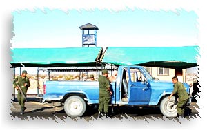 Military Checkpoint guards inspecting a truck outside san felipe